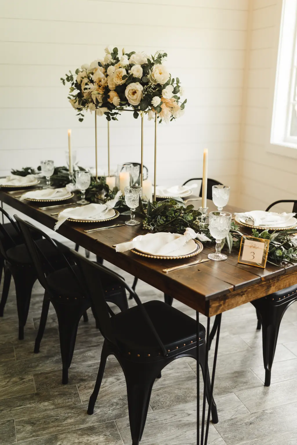 Modern and Rustic Indoor Wedding Reception | Tall Flower Stand Centerpieces with White Roses and Greenery | White and Gold Table Setting Ideas | Tampa Bay Florist Monarch Events and Design