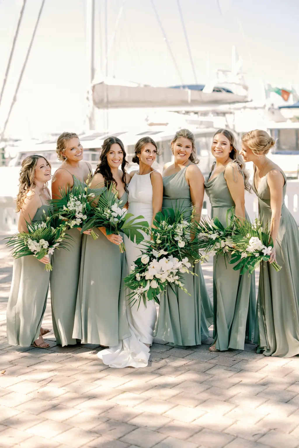 Brides with Bridesmaids Wedding Portrait in Pastel Sage Green Floor Length Bridesmaids Dresses