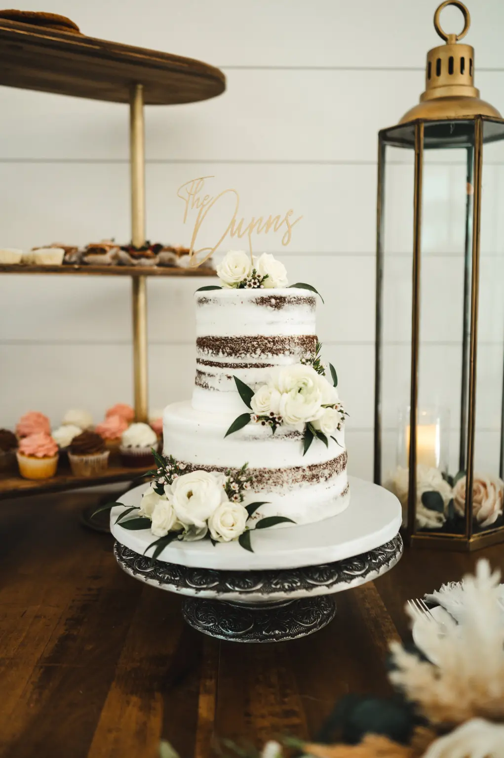 Semi-Naked Two Tiered Wedding Cake with White Rose Accents | Custom Gold Cake Topper