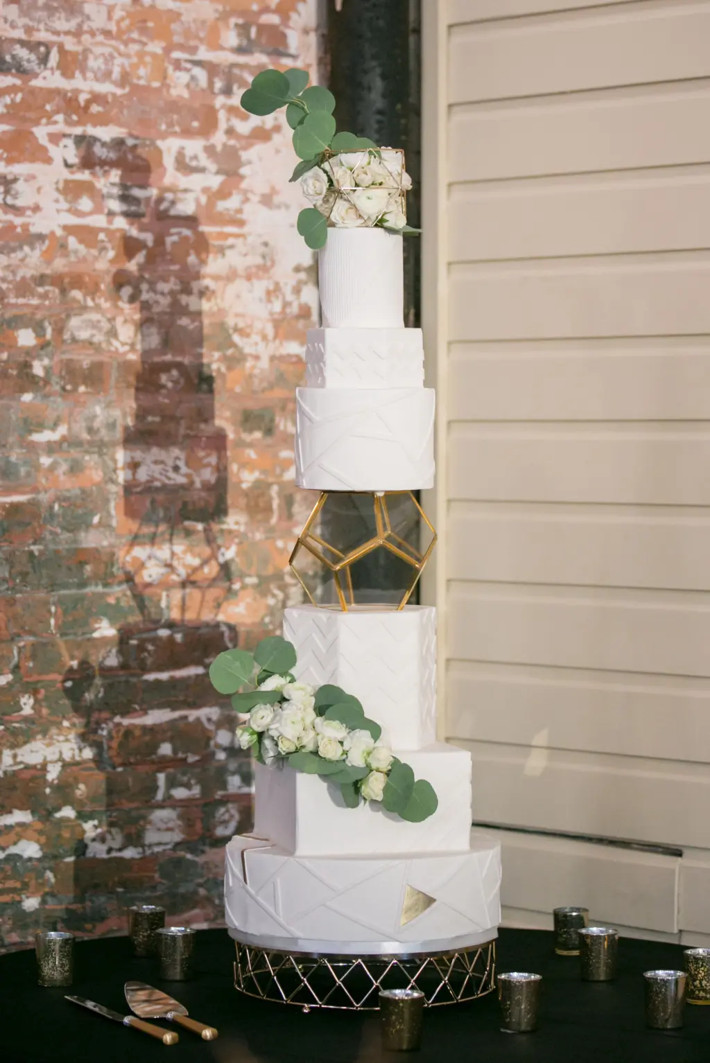 White Six-tiered Geometric Wedding Cake with White Rose Accents | Tampa Bay Bakery The Artistic Whisk