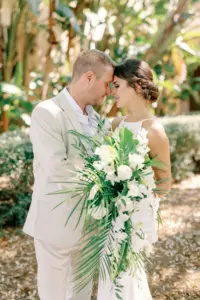 Bride and Groom Wedding Portrait with Florida Tropical Orchid Bouquet | Sarasota Planner Breezin Weddings