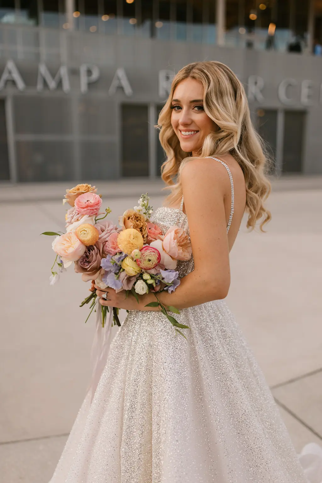 Spring Wedding Bridal Bouquet Inspiration with Pastel Orange and Pink Roses, Greenery, Gerpom, and Carnations | Glitter Boned Bodice A-Line Berta Wedding Dress Ideas | Classic Wedding Hair and Makeup Ideas | Tampa Bay Hair and Makeup Artist Femme Akoi Beauty Studio