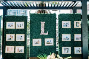 Privacy Hedge Wall with Custom Oyster Shell Initial Ideas | Bride and Groom Photo Wall | Old Florida Wedding Reception Inspiration | St. Pete Rentals Gabro Event Services