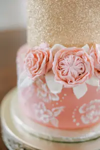 Round Two-tiered Wedding Cake Gold Glitter and Pink with Flower Detail and Garden Rose Accents