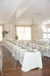 Ghost Acrylic Chairs | Long Feasting Tables | Classic White Wedding Reception Ideas | Tampa Florist Monarch Events and Designs | Kate Ryan Event Rentals