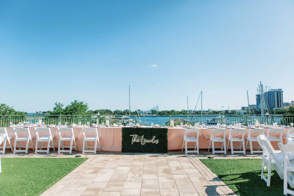 Long Feasting Head Table for Bridal Party | Custom Neon Sign | Downtown St. Pete Waterfront Wedding Reception Venue The Vinoy