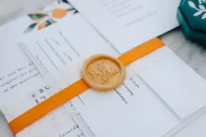 Florida-Inspired White Lace and Orange Ribbon Band with Seal for Wedding Invitation Ideas