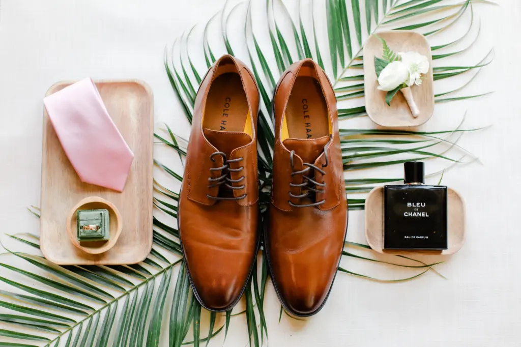 Brown Groom Wedding Shoes with Grooms Cologne and Cream Tropical Boutonniere Ideas