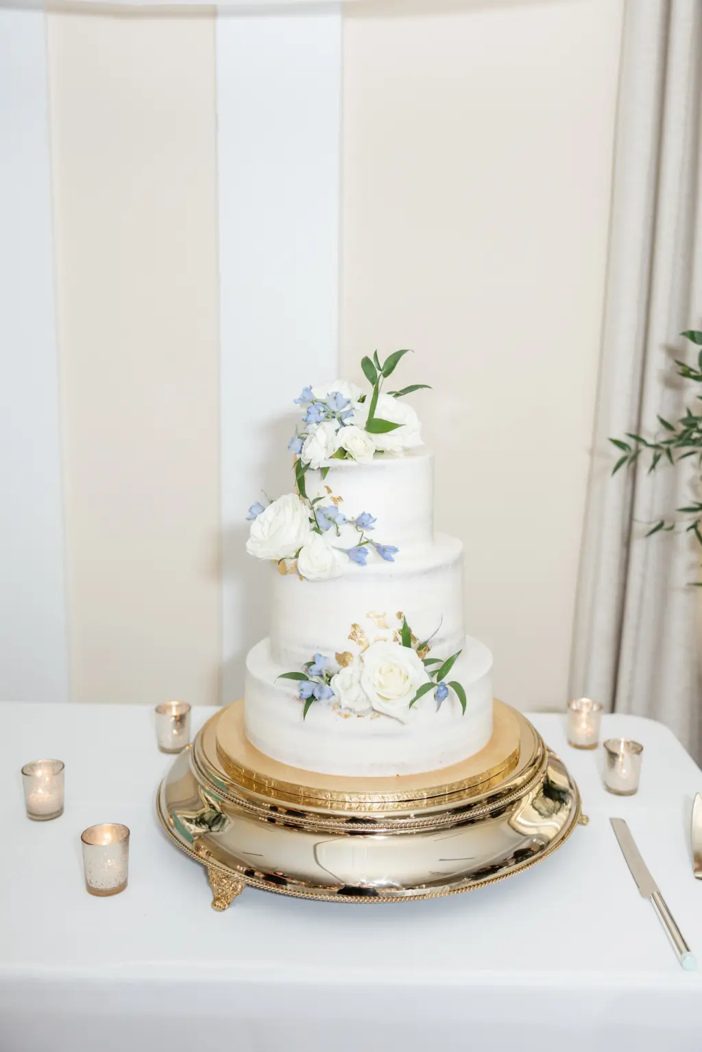 Round Three-tiered Wedding Cake with Blue Floral Accents Ideas