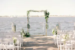 Simple Classic Waterfront Wedding Ceremony Inspiration with Greenery and Tropical Arch | Bradenton Waterfront Venue Pier 22