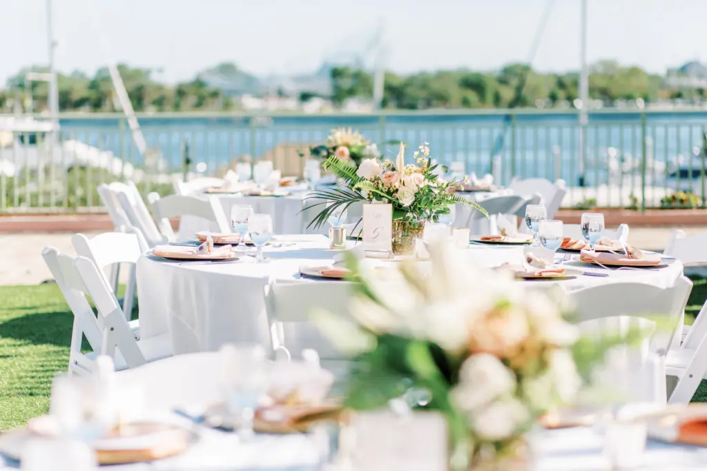White Garden Chairs and Linen with Blush Napkins | Palm Frond Centerpiece Ideas | Outdoor Old Florida Wedding Reception Inspiration | St. Pete Rentals Gabro Event Services | Planner and Florist Lemon Drops Weddings and Events
