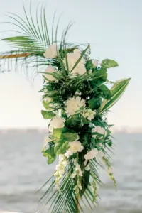 White Floral Wedding Ceremony Arch Ideas with Tropical Greenery