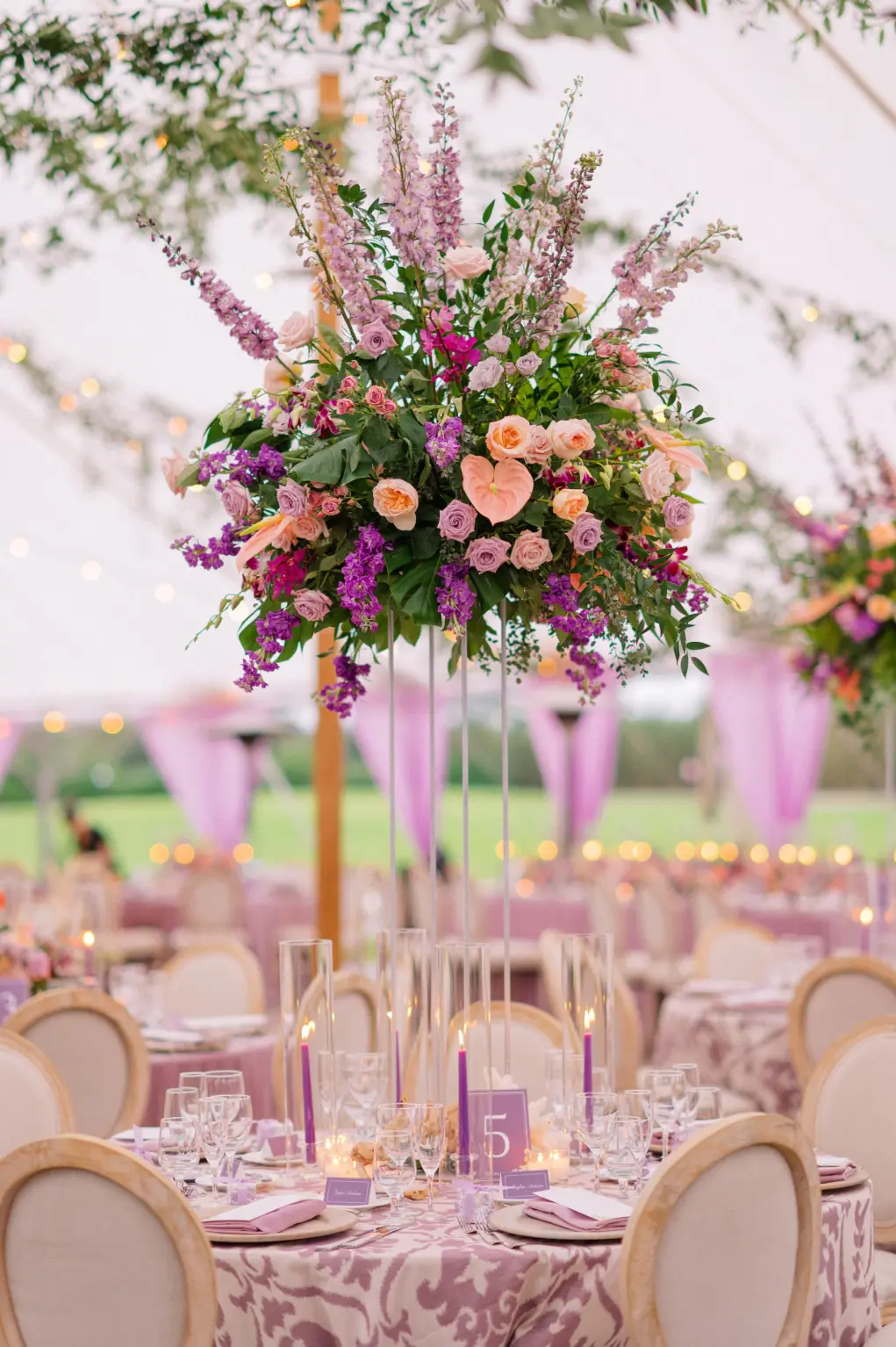 Tall Flower Stand with Purple and Orange Roses, Stock Flowers and Greenery Wedding Reception Centerpieces | Sarasota Florist Botanica Design Studio