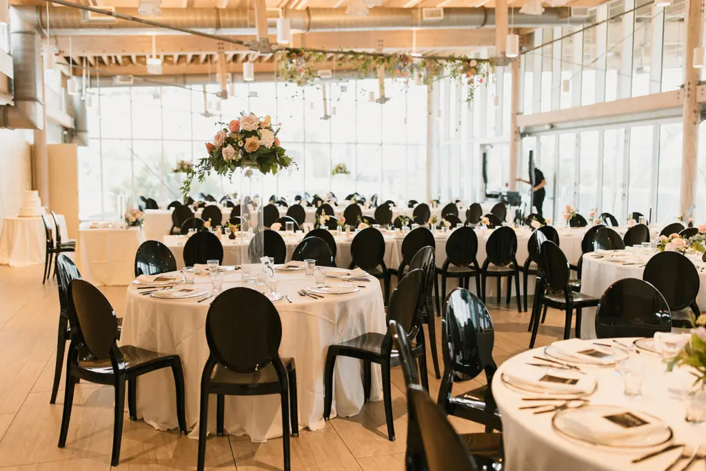 Modern Black and White Spring Wedding Reception Inspiration | Black Acrylic Chairs and Long Feasting Tables from Event Rentals A Chair Affair | Tampa Bay Planner Coastal Coordinating | Downtown Event Venue Tampa River Center