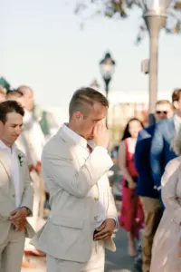 Groom Sees Bride Walk Down the Aisle for the First Time Wedding Portrait