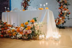 Orange Carnations, Pink and White Roses and Chrysanthemum Wedding Reception Sweetheart Table Floor Flower Arrangement Inspiration