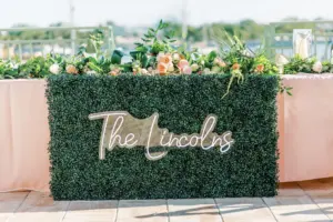 Custom Neon Sign for Head Table | Long Feasting Table for Bridal Party | Tropical Blush Pink Rose and Greenery Tabletop Garland Ideas for Wedding Reception | Downtown St. Pete Planner Planner and Florist Lemon Drops Weddings and Events