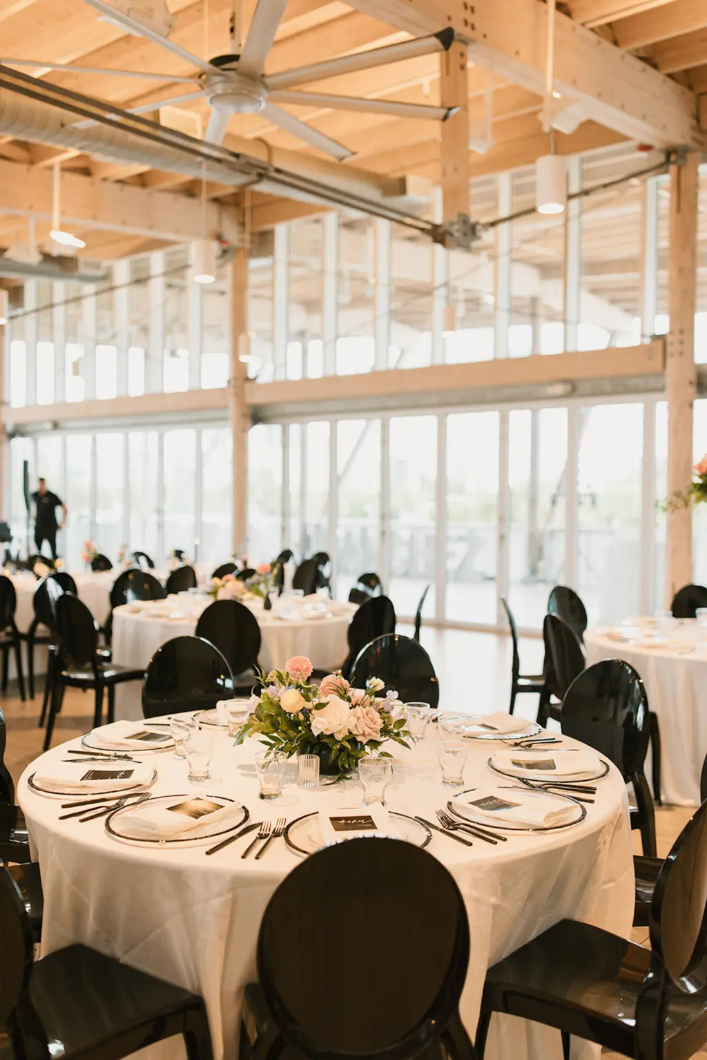 Modern Black and White Spring Wedding Reception Inspiration | Black Acrylic Chairs and Round Tables from Florida Event Rentals A Chair Affair | Tampa Bay Planner Coastal Coordinating | Downtown Heights Event Venue Tampa River Center
