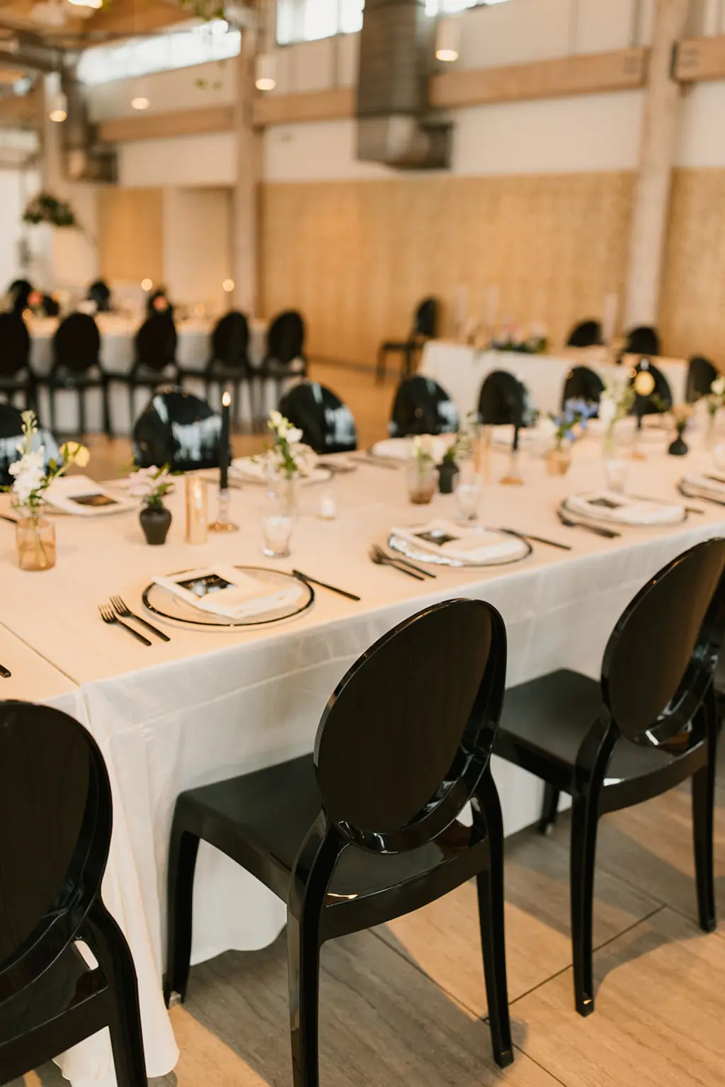 Modern Black Acrylic Chairs for Long Feasting Table from Tampa Bay Event Rentals A Chair Affair | Black and White Wedding Reception Decor Ideas