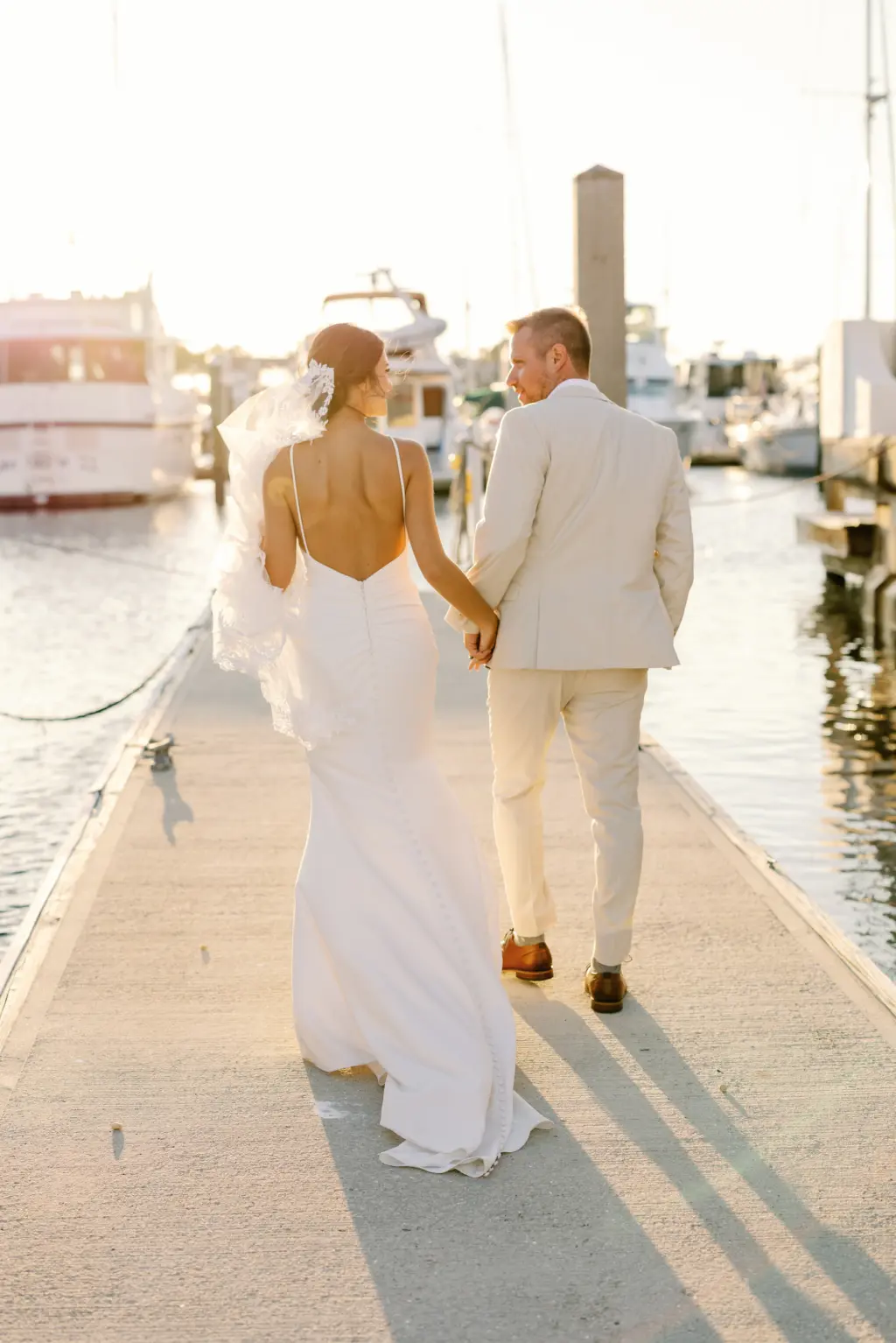Bride and Groom Golden Hour Sunset Waterfront Wedding Portraits | Sarasota Planner Breezin Weddings | Waterfront Venue Pier 22