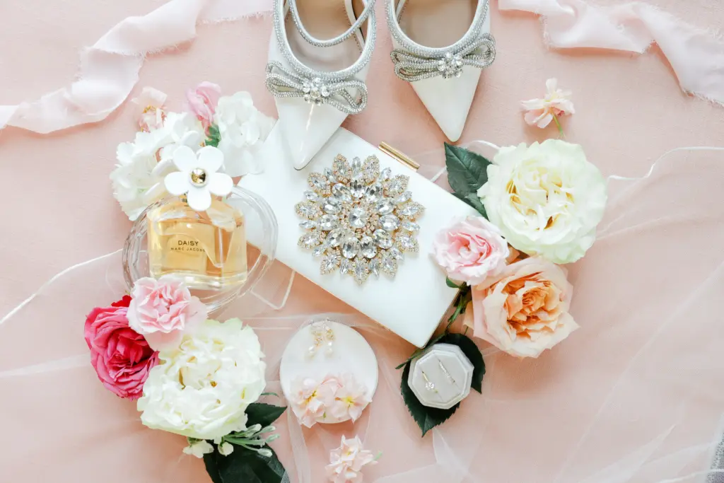 White Clutch Purse with Jewel Detail and White Shoes with Silver Bejeweled Bows | Tropical Peach and Pink Wedding Ideas