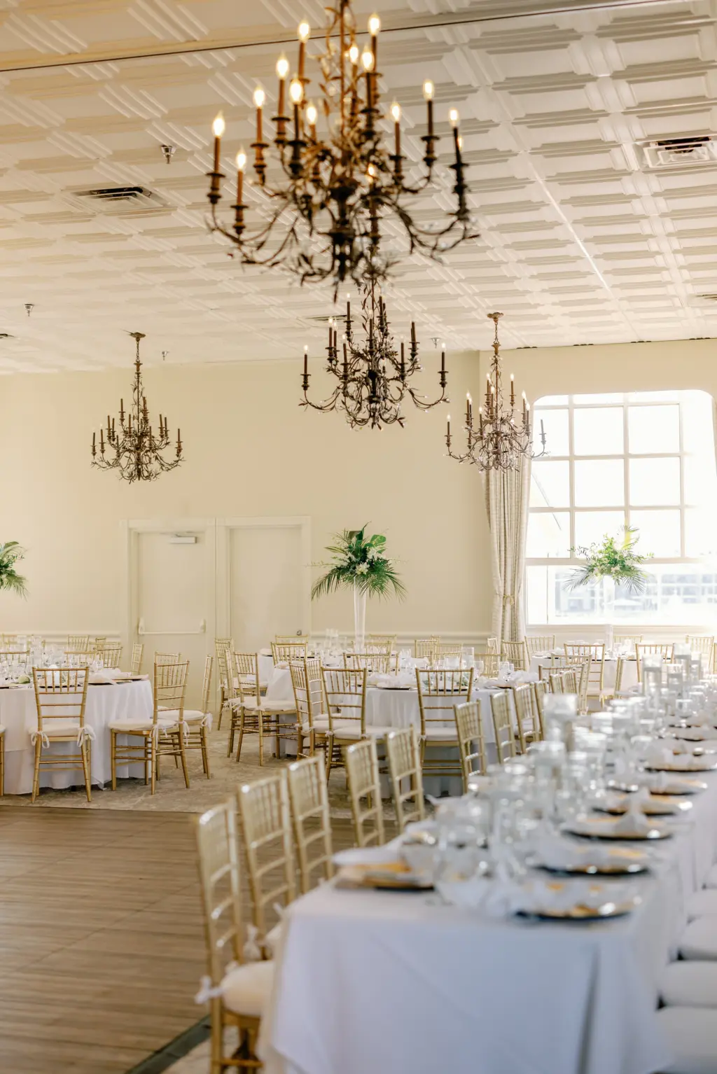 Classic Tropical Wedding Reception Decor Ideas with Gold Chiavari Chairs and Vintage Chandeliers | Bradenton Waterfront Venue Pier 22