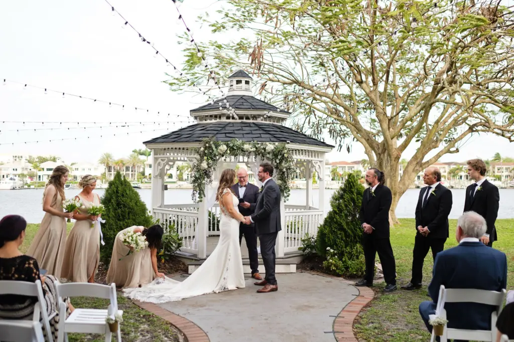 Bride and Groom First Kiss Wedding Portrait | Gazebo Wedding Ceremony Ideas | Tampa Bay Planner The Olive Tree Weddings