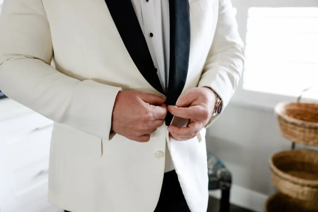 White Tuxedo with Black Lapel Groom's Wedding Suit Inspiration