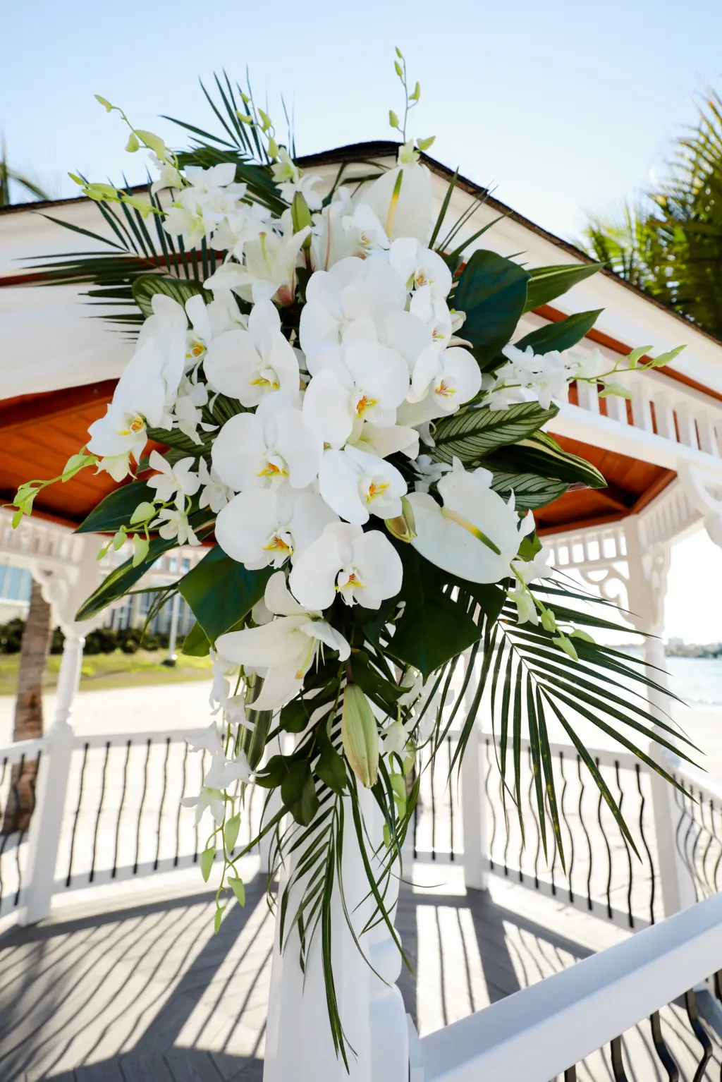 Tropical White Orchids, Stock Flowers, and Greenery Floral Arrangements for Old Florida Wedding Ceremony Gazebo Backdrop Ideas