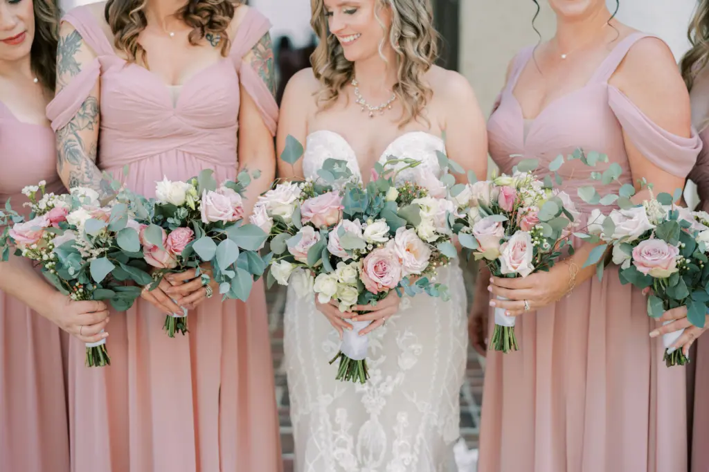 Pink and White Roses, Greenery, and Baby's Breath Wedding Bouquet Ideas | Azazie Dusty Rose Bridesmaids and Bride Oleg Cassini Wedding Dress