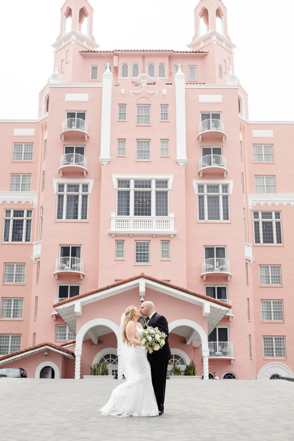 Bride and Groom Kissing in Front of The Pink Palace | Saint Petersburg Wedding Venue The Don CeSar