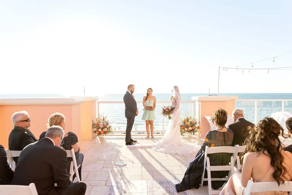 Bride and Groom Exchange Vows in Intimate Rooftop Clearwater Beach Florida Wedding Ceremony Inspiration | Tampa Wedding Venue Hyatt Regency Clearwater Beach