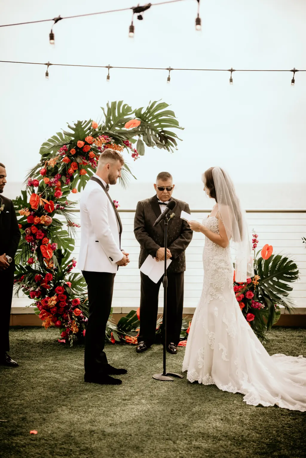 Bride and Groom Exchange Vows in Waterfront Tropical Wedding Ceremony | Clearwater Florist Save the Date Florida