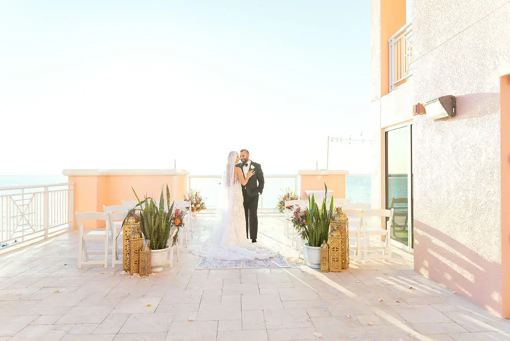 Intimate Micro Wedding Rooftop Florida Wedding Ceremony Inspiration with Bright and Tropical Florals | Venue Hyatt Regency Clearwater Beach | Planner Special Moments Event Planning