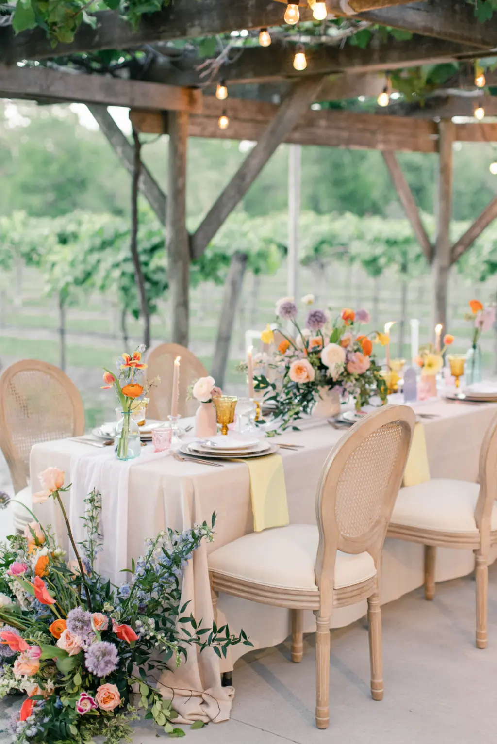 Spring Whimsical Outdoor Vineyard Wedding Reception Decor Inspiration | Cane Rattan White Oak Chairs | Orange Orchids, Blue Stock Flowers, Pink Garden Rose Floor and Feasting Table Centerpiece Ideas | Tampa Bay Florist Save The Date Florida | Planner MDP Events