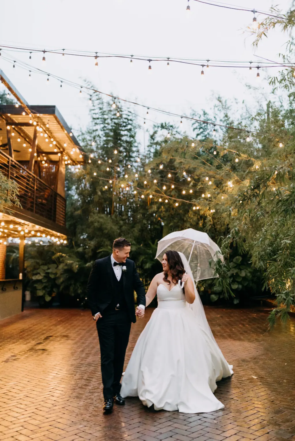 Bride and Groom Bamboo Courtyard Wedding Portrait with Umbrella | Justin Alexander Ballgown Dress | Photographer Amber McWhorter Photography | Downtown St Pete Venue NOVA 535