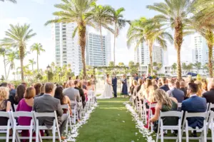 Classic Outdoor Waterfront Burgundy Wedding Ceremony Ideas | White Garden Folding Garden Chairs | Ritz Carlton Sarasota