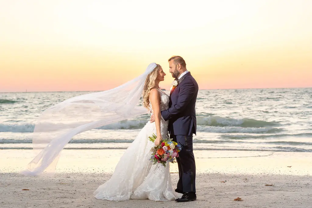 Bride and Groom Veil Beach Wedding Portrait at Sunset | Planner Special Moments Event Planning | Venue Hyatt Regency Clearwater Beach