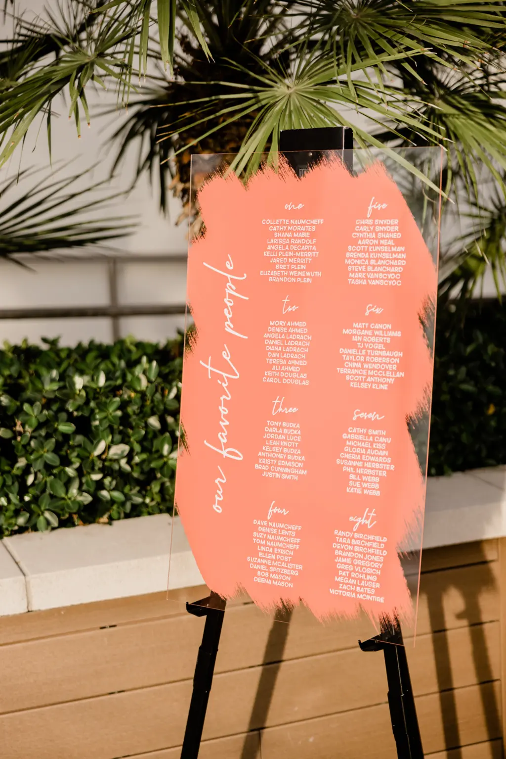 Coral Pink Acrylic Seating Chart with White Writing Tropical Wedding Inspiration