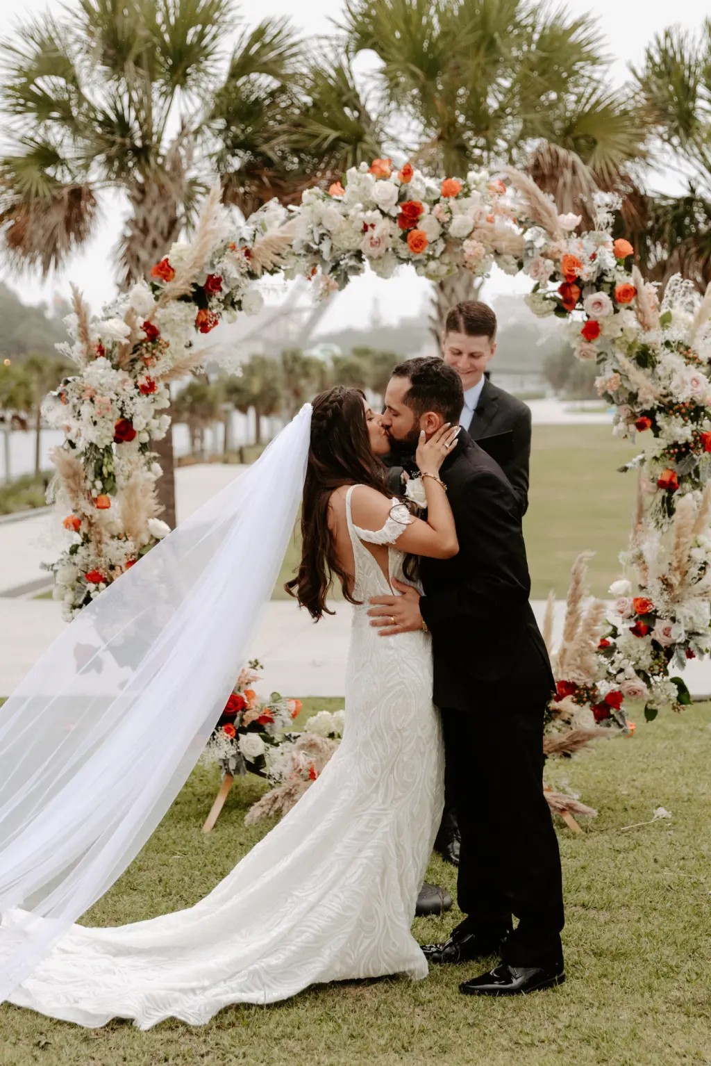 Bride and Groom First Kiss Wedding Portrait | Tampa Bay Planner Breezin Weddings