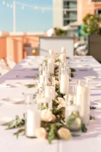 Intimate Wedding Reception Feasting Tablescape with Candles in Hurricane Glasses with Greenery Ideas