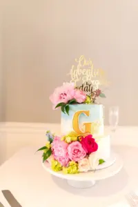 Two Tier Blue Ombre Wedding Cake with Gold G and Gold Acrylic Cake Topper and Pink Florals Ideas