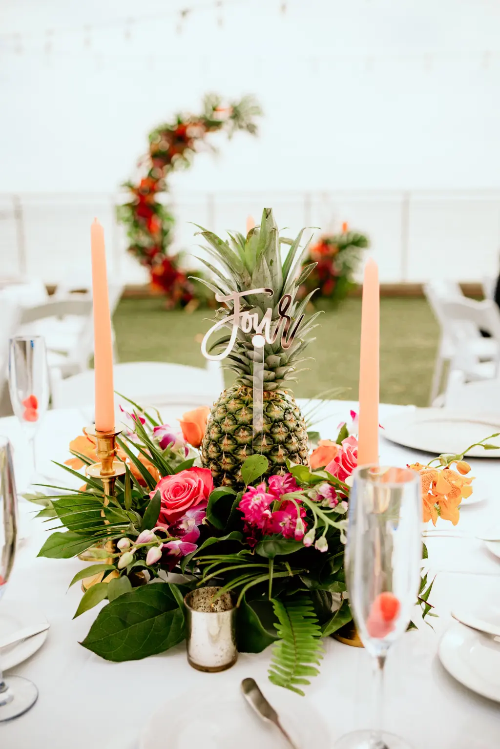 Tropical Wedding Inspiration with Pineapple and Monstera Leaf Centerpieces | Coral Tapered Candles with Gold Accents | Clearwater Beach Florist Save the Date Florida