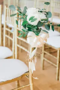 Gold Chiavari Chairs with White Florals and Greenery Detail | Reserved Seating Laser Cut Sign | Tampa Wedding Rental Kate Ryan Event Rentals