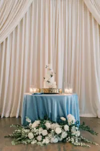 Pastel Blue Wedding Cake Table Inspiration with Garden Roses, Stock Flowers, and Greenery Floor Floral Arrangement | Tampa Bay Cake Company
