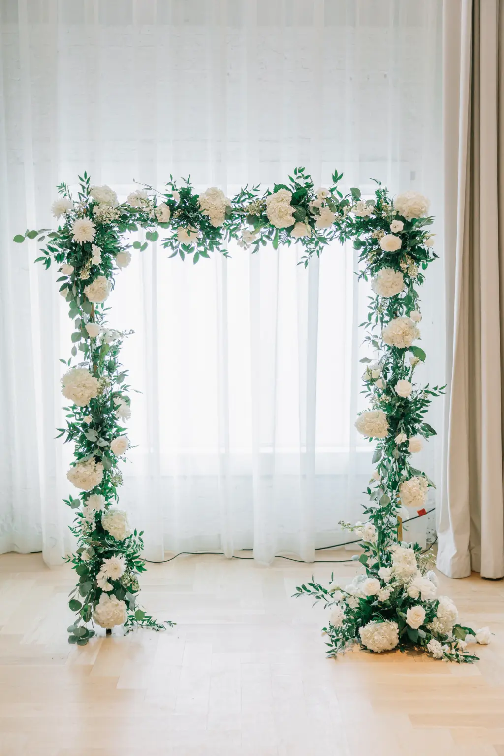 White Rose Arch with Greenery Detailing Wedding Ceremony Decoration Inspiration