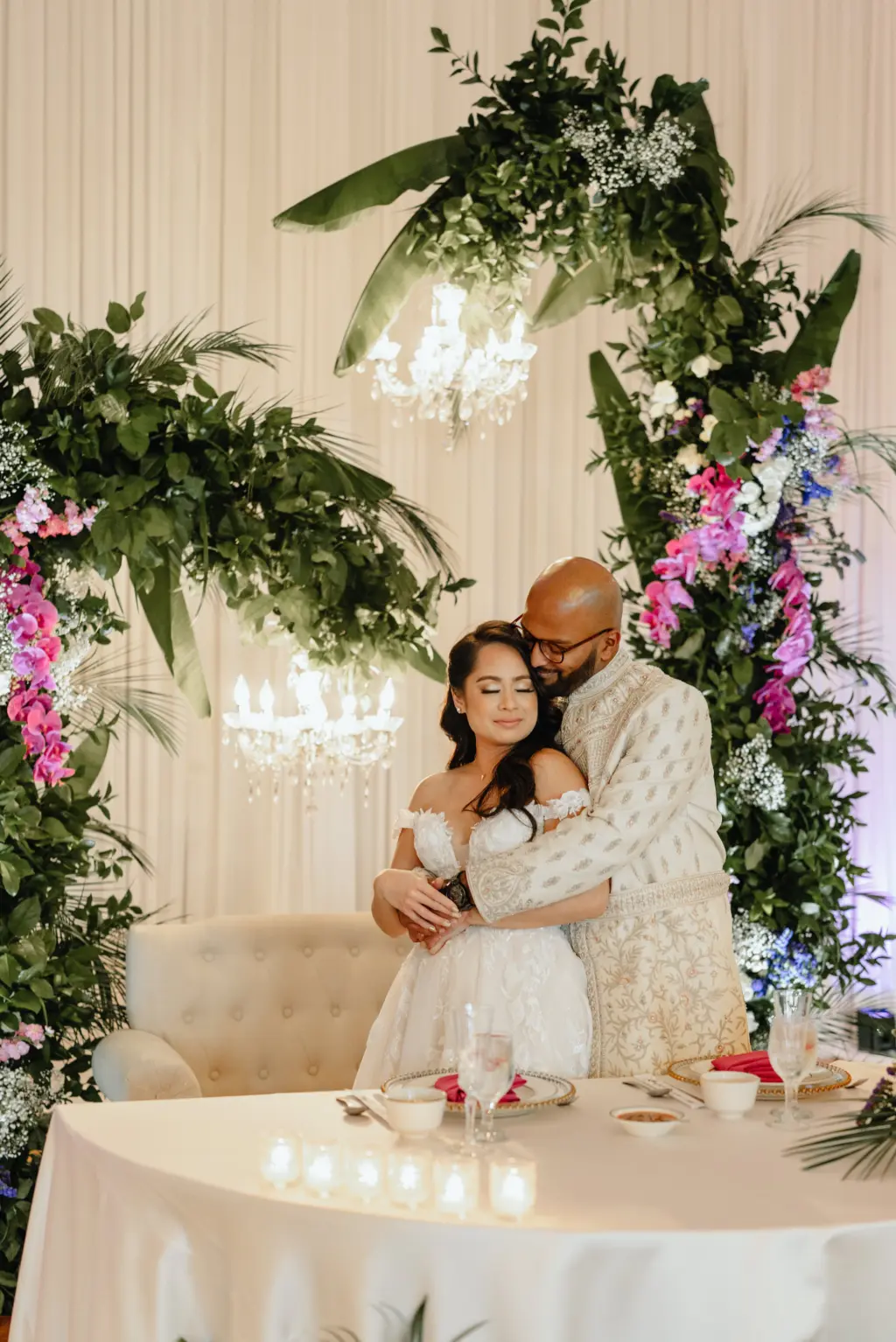 Bride and Groom at Floral Inspired Sweetheart Table Wedding Portrait | Tampa Wedding Photographer J&S Media