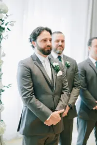 Groom Sees Bride Walking Down the Aisle for the First Time Wedding Portrait