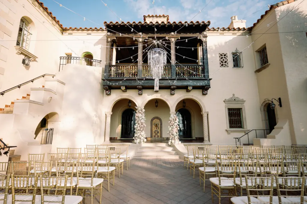 Romantic Outdoor Courtyard Wedding Ceremony Ideas | Crystal Chandelier Lighting | Gold Chiavari Chairs | Sarasota Venue Powel Crosley Estate