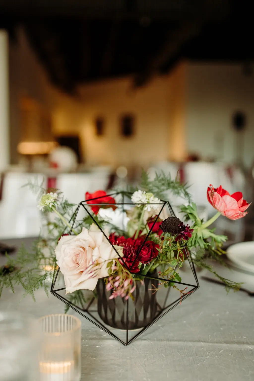 Black Geometric Centerpiece with Pink Roses, Red Carnations, and Protea | Modern Asian Wedding Reception Inspiration Ideas